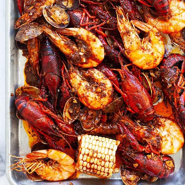 a cajun seafood boil with shrimp corn lobster crawfish and butter garlic sauce delivered locally free