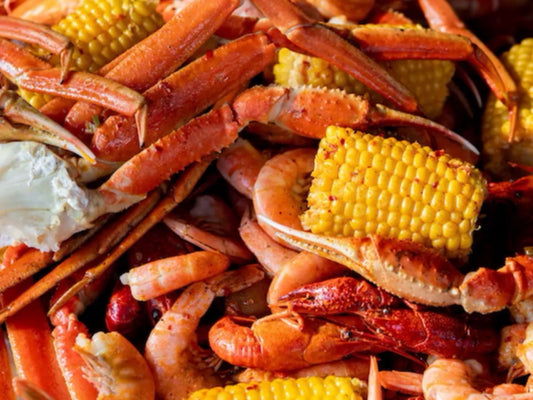 Seafood boil bag with crab legs, shrimp, crawfish, corn on the cob, and Cajun seasoning in Los Angeles