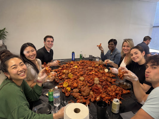 Fresh seafood boil catering spread with shrimp, snow crab, crawfish, lobster tails, corn, potatoes, garlic butter, and cornbread prepared by Boil Baby Boil for a Los Angeles corporate event.