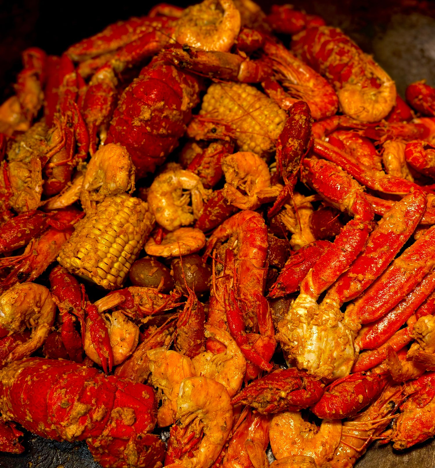 Family-size Cajun seafood boil with shrimp, crab, crawfish, sausage, and sides, perfect for parties and events in West Hollywood