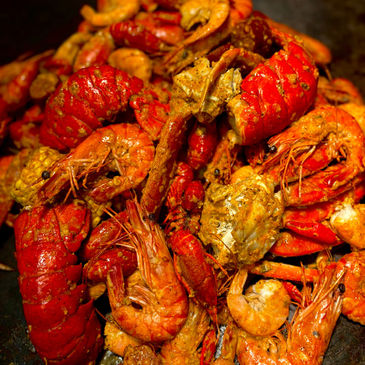 Steamy Cajun seafood boil bag loaded with shrimp, sausage, and corn from Boil Baby Boil—West Hollywood’s go-to for bold flavor and late-night eats.