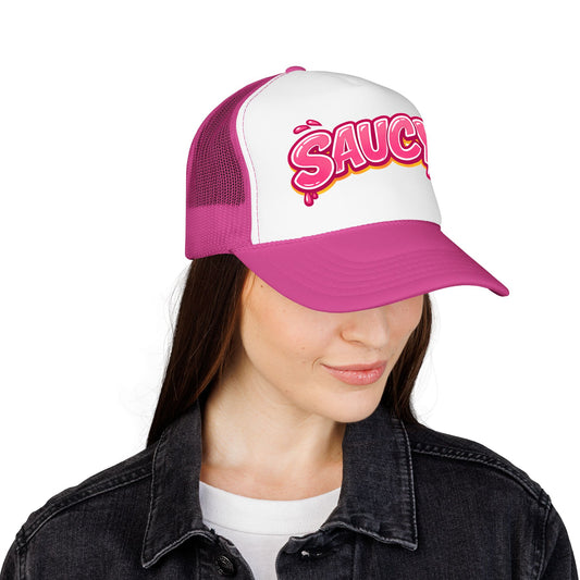 Model wearing Boil Baby Boil Saucy bubblegum pink foam trucker hat, pulled low with SAUCY logo front facing, paired with dark jacket
