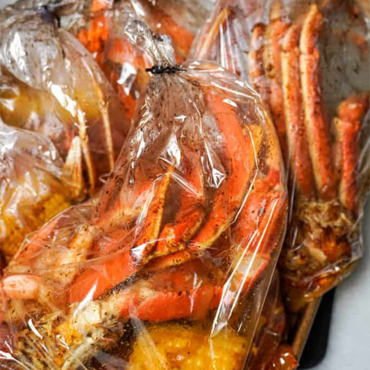 Seafood boil bags with snow crab, shrimp & corn—Boil Baby Boil catering, Los Angeles.
