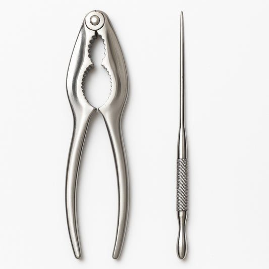 Stainless steel seafood cracker and knife tools for Cajun seafood boil preparation on white background