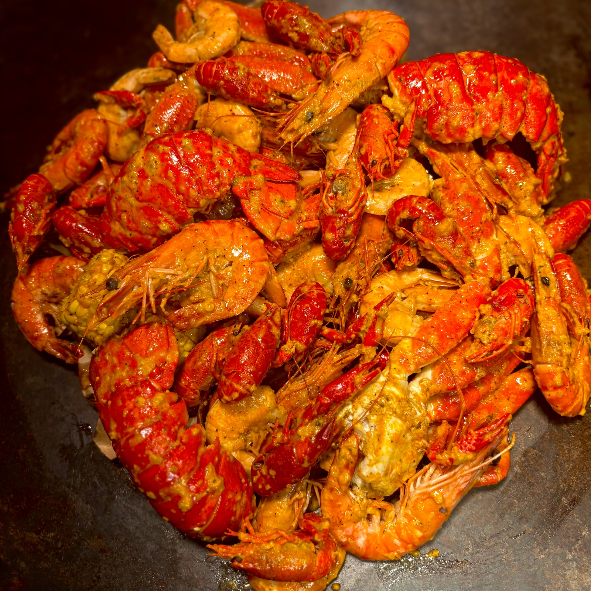 Garlic butter shrimp boil with corn and sausage from Boil Baby Boil in West Hollywood—top-rated late-night Cajun seafood for delivery and takeout.