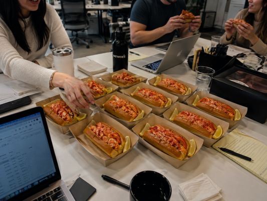Tray of warm Connecticut-style lobster rolls delivered by Boil Baby Boil for office lunch catering in Los Angeles.