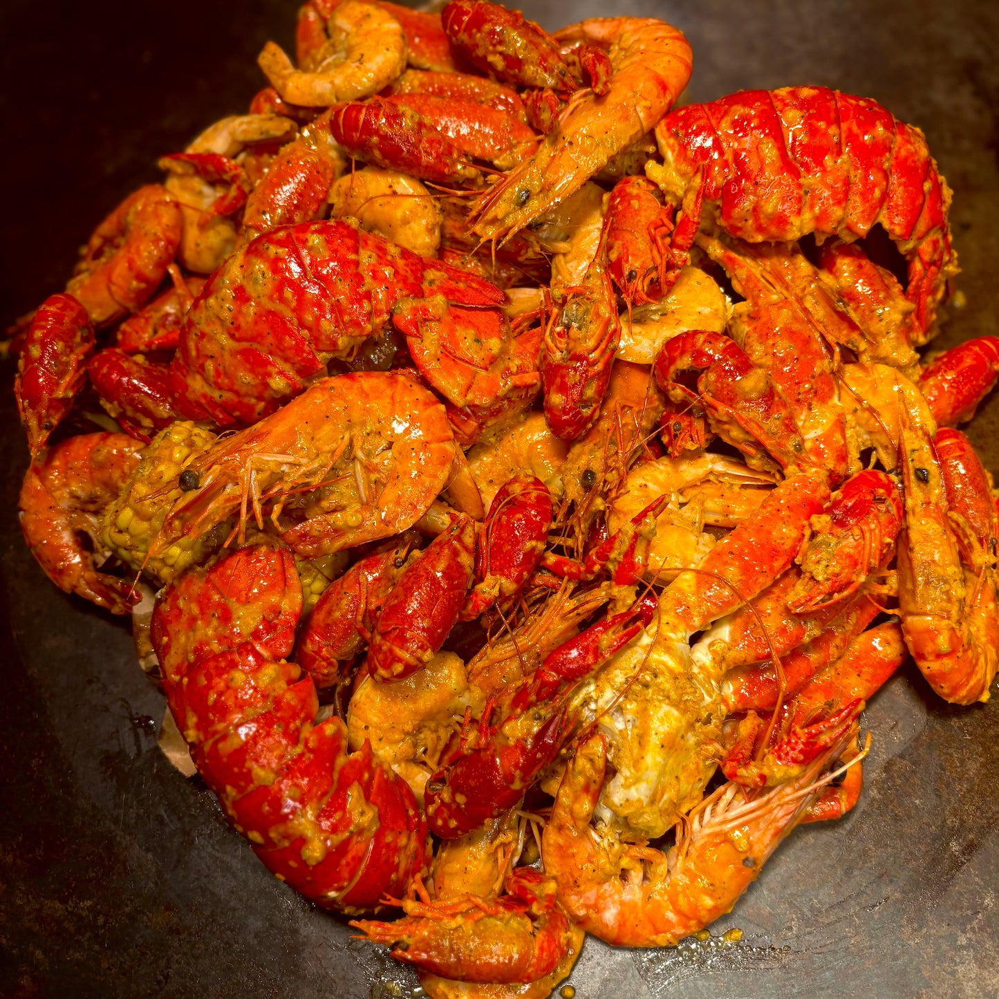 Fresh cooked crawfish, shrimp, and corn from seafood boil feast